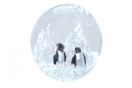 Small dream ball with two penguins in the Arctic Sea. 